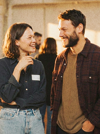 People laughing together at an event